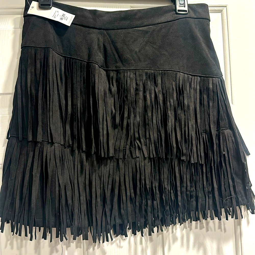 Brand new country style suede black fringe skirt from Francesca’s new with tags.